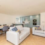 Spacious open-plan kitchen, dining and living area at Eskdale Sidings apartments