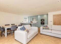 Spacious open-plan kitchen, dining and living area at Eskdale Sidings apartments